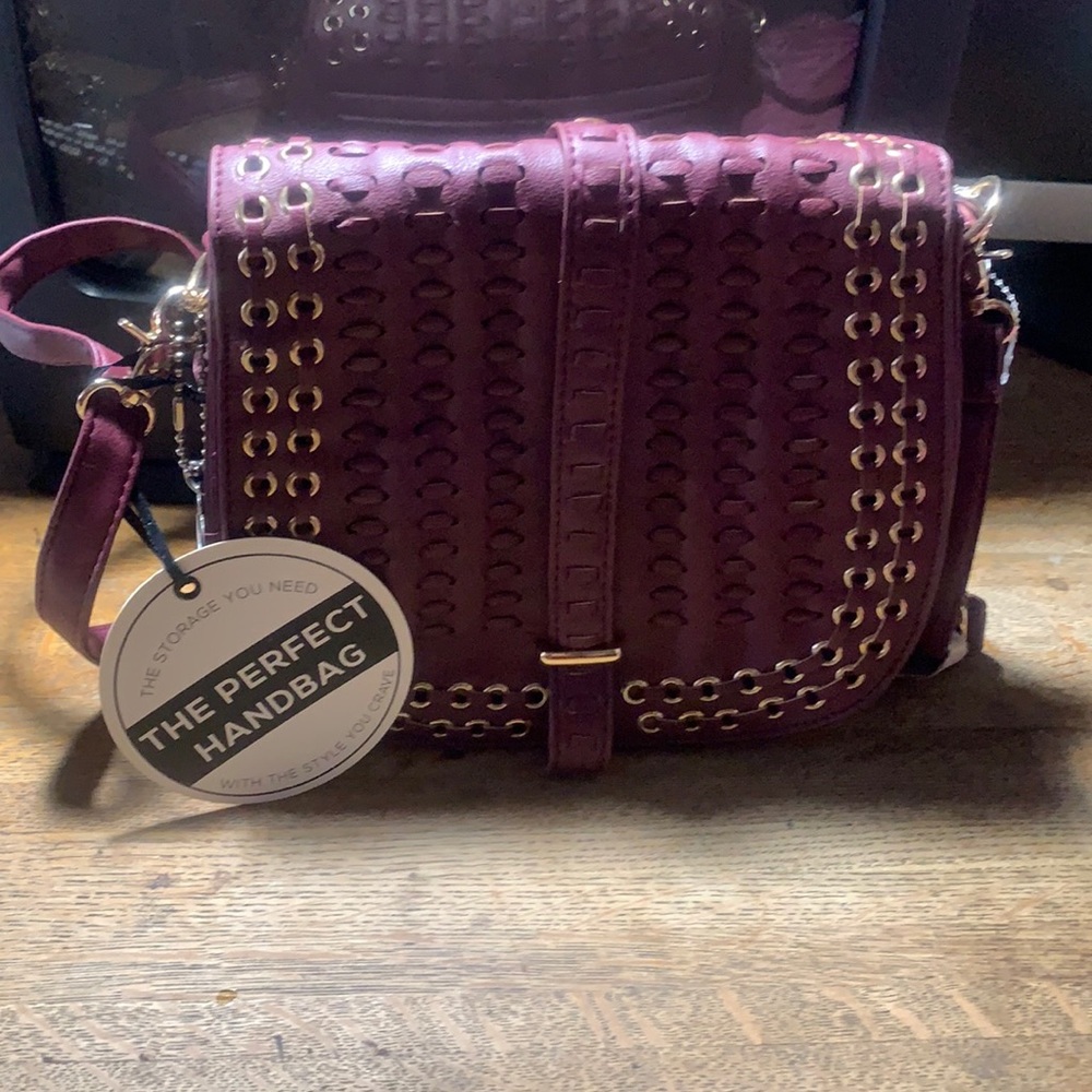 Burgundy cross body purse.